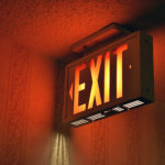 Illuminated emergency exit on hotel hallway